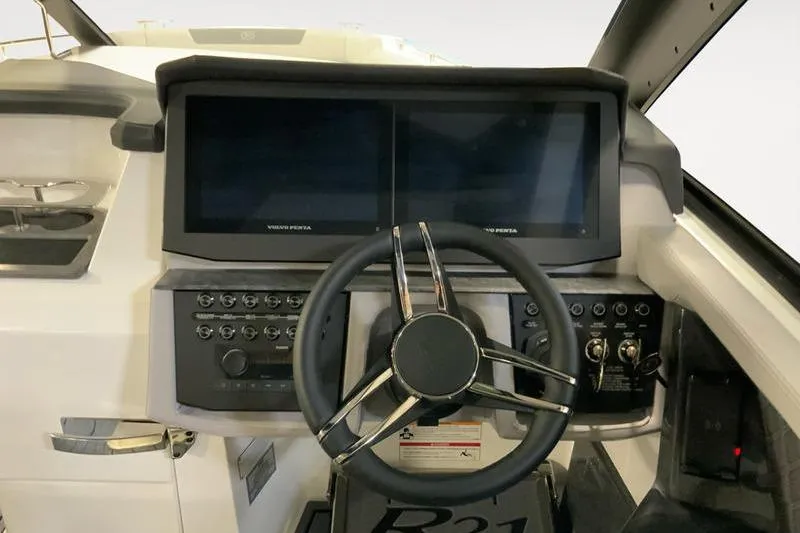Slide: The Image of 2026 Cobalt R31 boat interior with modern seating and sleek design. - 12