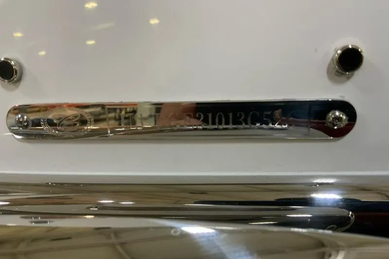 Slide: The Image of 2026 Cobalt R31 boat interior with sleek gray seating and cup holders. - 18