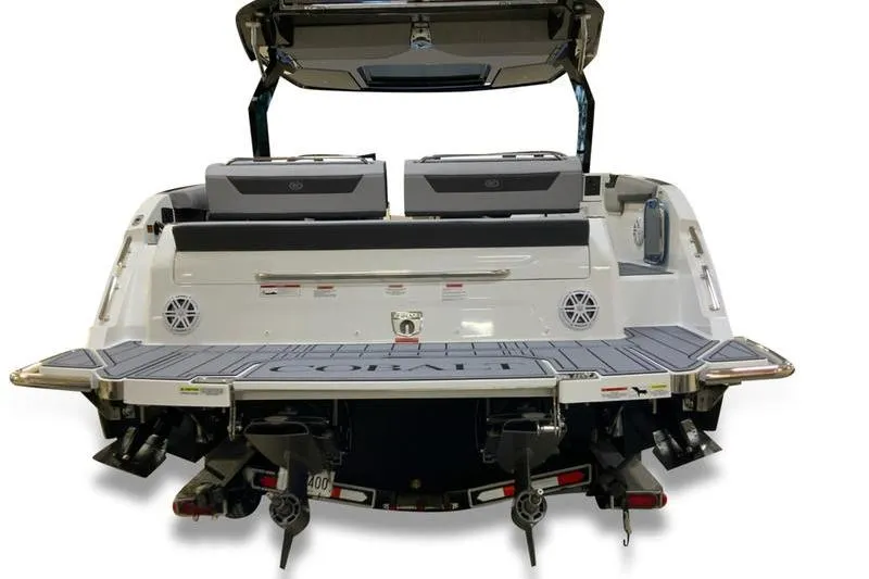 Slide: The Image of 2026 Cobalt R31 boat on trailer, sleek black design, modern features. - 4