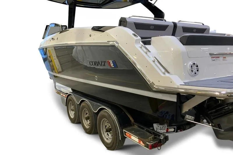 Slide: The Image of 2026 Cobalt R31 boat displayed indoors under bright lighting. - 5