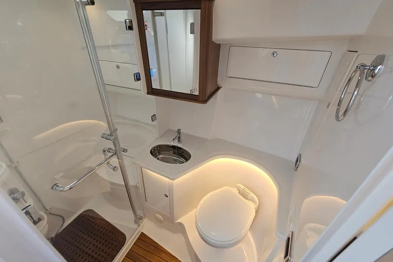 Slide: The Image of Luxurious bathroom in 2026 Intrepid 438 Evolution yacht with modern fixtures and elegant lighting. - 10
