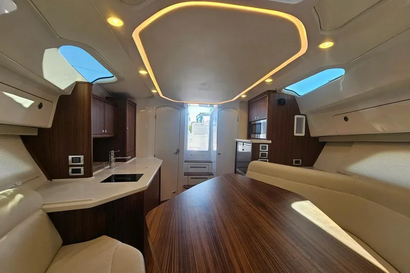 Slide: The Image of Luxurious interior of 2026 Intrepid 438 Evolution yacht with modern design and wood accents. - 14