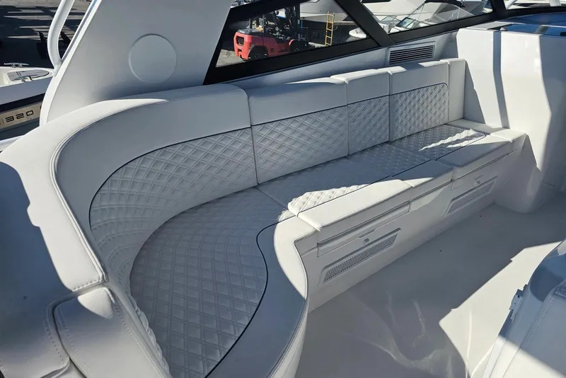 Slide: The Image of Luxurious white seating on 2026 Intrepid 438 Evolution yacht, featuring quilted upholstery. - 5