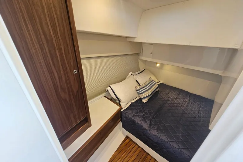 Slide: The Image of Cozy cabin interior of 2026 Intrepid 438 Evolution with bed and wooden accents. - 9