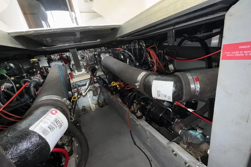 Slide: The Image of Engine room of a 1997 Sea Ray 400 Express Cruiser with visible components and wiring. - 4