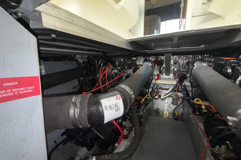 Slide: The Image of Engine room of a 1997 Sea Ray 400 Express Cruiser with visible components and wiring. - 6