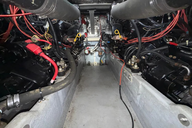 Slide: The Image of Engine room of a 1997 Sea Ray 400 Express Cruiser with visible wiring and components. - 7