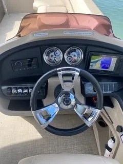 Slide: The Image of 2022 Avalon Catalina Entertainer dashboard with steering wheel and navigation system. - 11