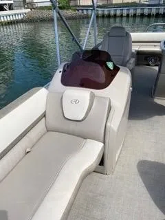 Slide: The Image of 2022 Avalon Catalina Entertainer 24' boat interior with seating and helm. - 20