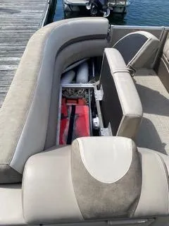 Slide: The Image of 2022 Avalon Catalina Entertainer boat interior with open storage compartment. - 21