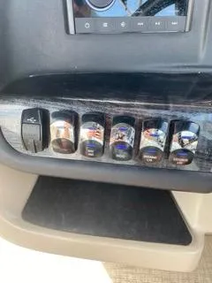 Slide: The Image of Control panel of 2022 Avalon Catalina Entertainer 24' boat with labeled switches. - 8