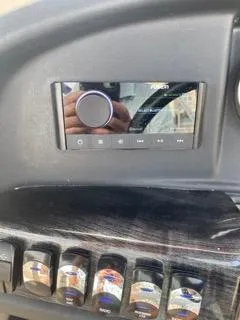 Slide: The Image of 2022 Avalon Catalina Entertainer dashboard with control panel and switches. - 9