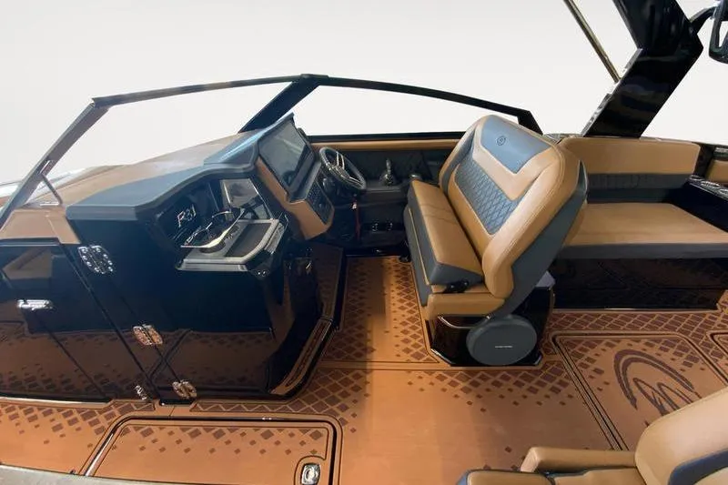 Slide: The Image of 2026 Cobalt R31 Surf boat interior with luxurious brown seating and modern dashboard. - 10