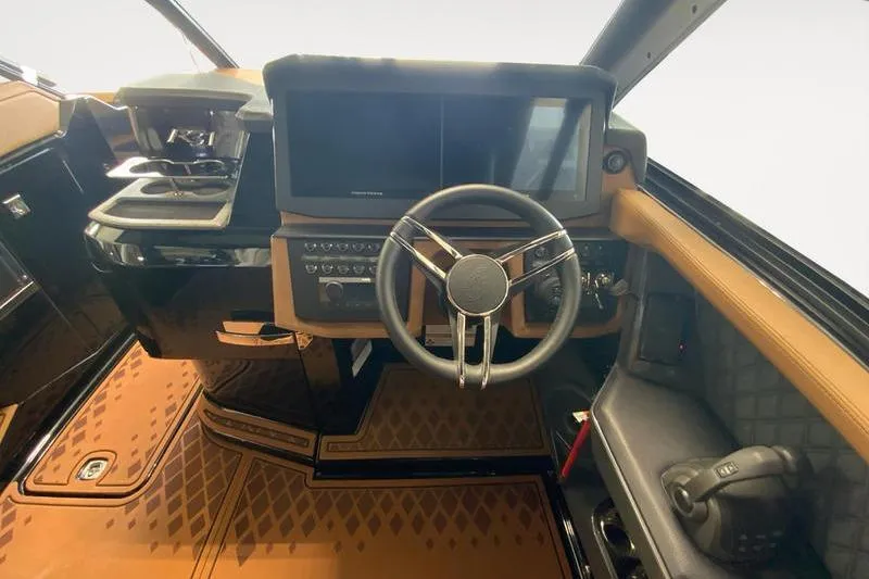 Slide: The Image of Interior of 2026 Cobalt R31 Surf boat with modern dashboard and steering wheel. - 11