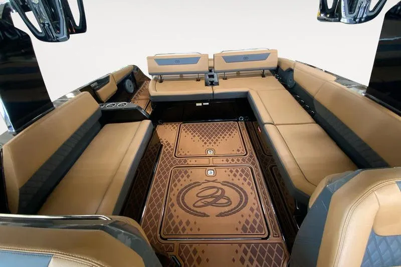 Slide: The Image of Luxurious interior of 2026 Cobalt R31 Surf boat with tan seating and custom flooring. - 12