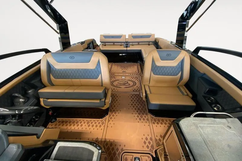 Slide: The Image of 2026 Cobalt R31 Surf boat interior with luxurious tan and gray seating. - 13