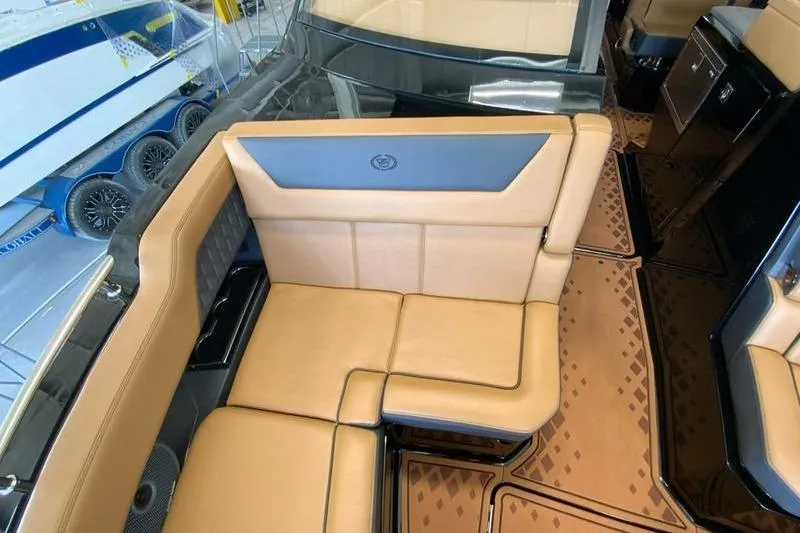 Slide: The Image of Luxurious tan seating in 2026 Cobalt R31 Surf boat interior. - 15