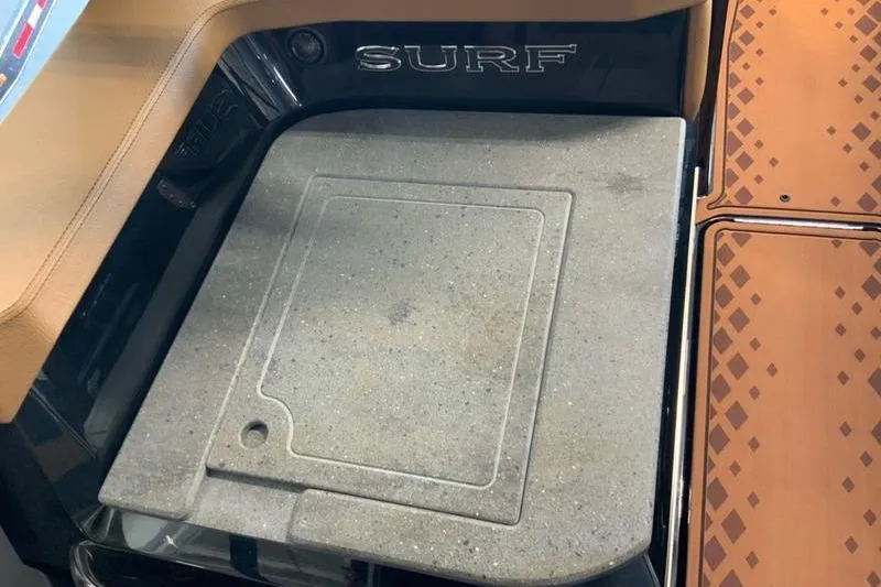 Slide: The Image of 2026 Cobalt R31 Surf boat interior with textured flooring and "SURF" branding. - 21