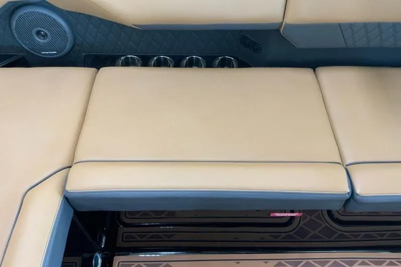 Slide: The Image of 2026 Cobalt R31 Surf boat interior with tan leather seating and built-in speakers. - 23