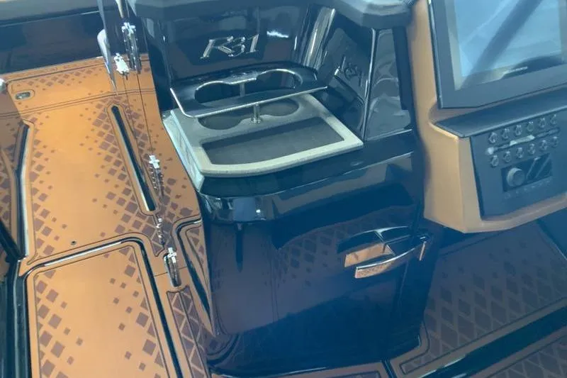 Slide: The Image of 2026 Cobalt R31 Surf boat interior with sleek dashboard and modern controls. - 25