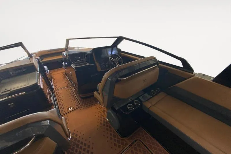 Slide: The Image of Interior of 2026 Cobalt R31 Surf boat with luxurious seating and modern dashboard. - 8