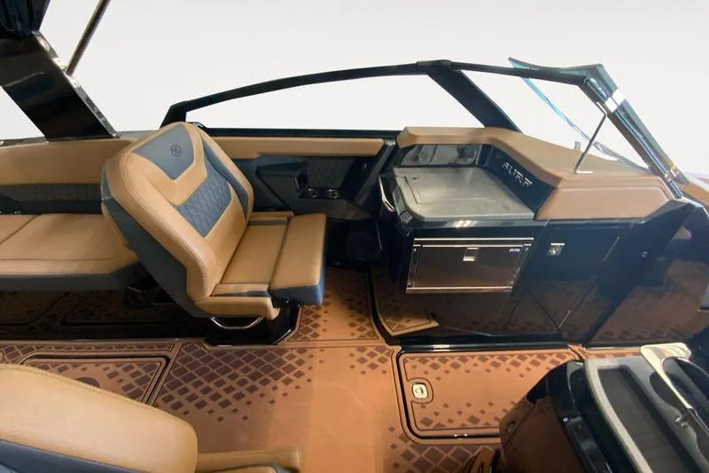 Slide: The Image of 2026 Cobalt R31 Surf boat interior with luxurious seating and modern dashboard design. - 9