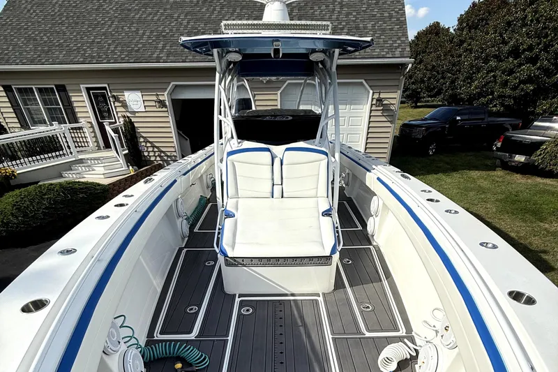 Slide: The Image of 2017 Nor-Tech 392 Superfish boat with sleek design, parked near a house. - 10