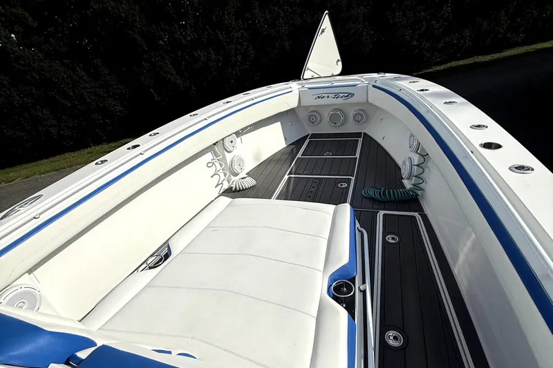 Slide: The Image of 2017 Nor-Tech 392 Superfish boat interior with white seating and blue accents. - 13