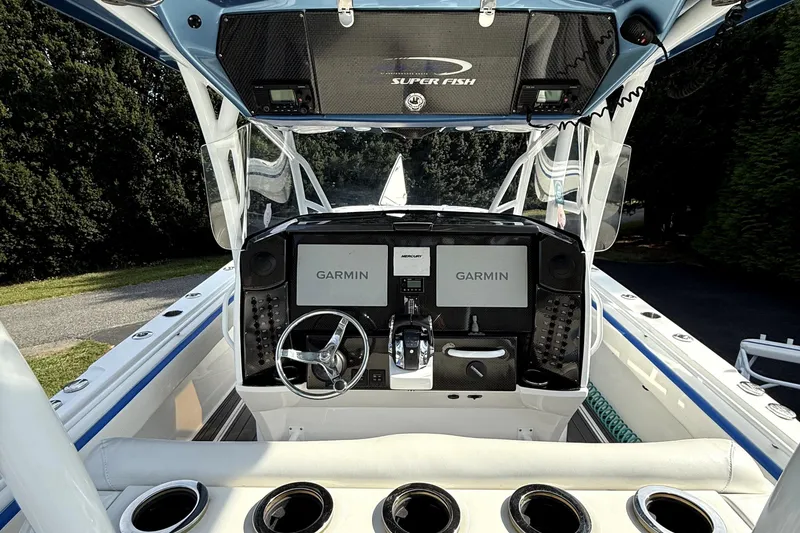 Slide: The Image of 2017 Nor-Tech 392 Superfish boat cockpit with Garmin navigation system and steering wheel. - 7