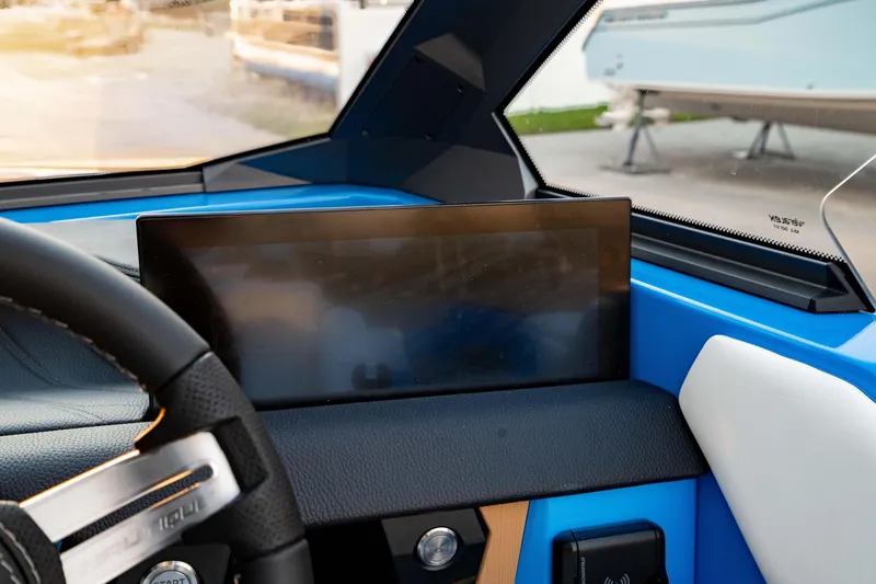Slide: The Image of 2026 Nautique Ski Nautique dashboard with touchscreen display and steering wheel detail. - 5
