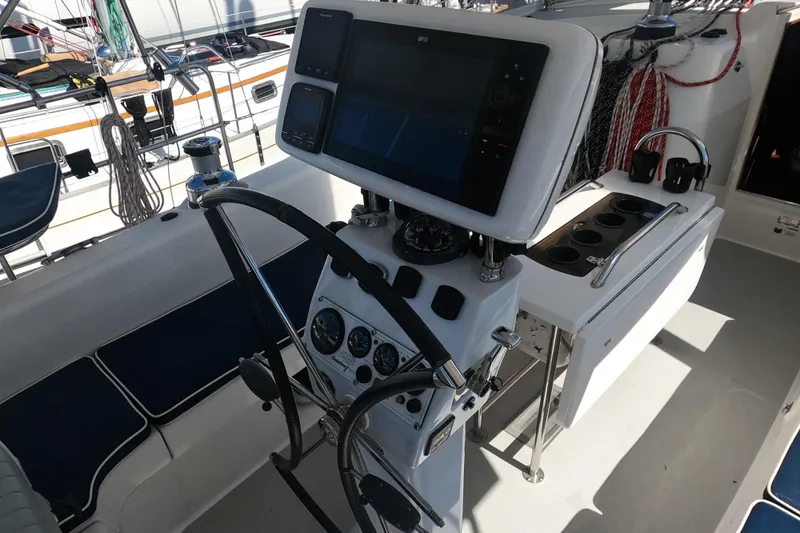 Slide: The Image of Cockpit of 2005 Catalina Morgan 440 sailboat with navigation equipment and steering wheel. - 12
