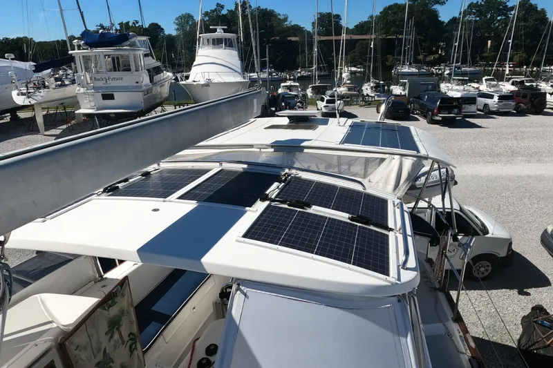Slide: The Image of 2005 Catalina Morgan 440 sailboat with solar panels in a marina. - 19