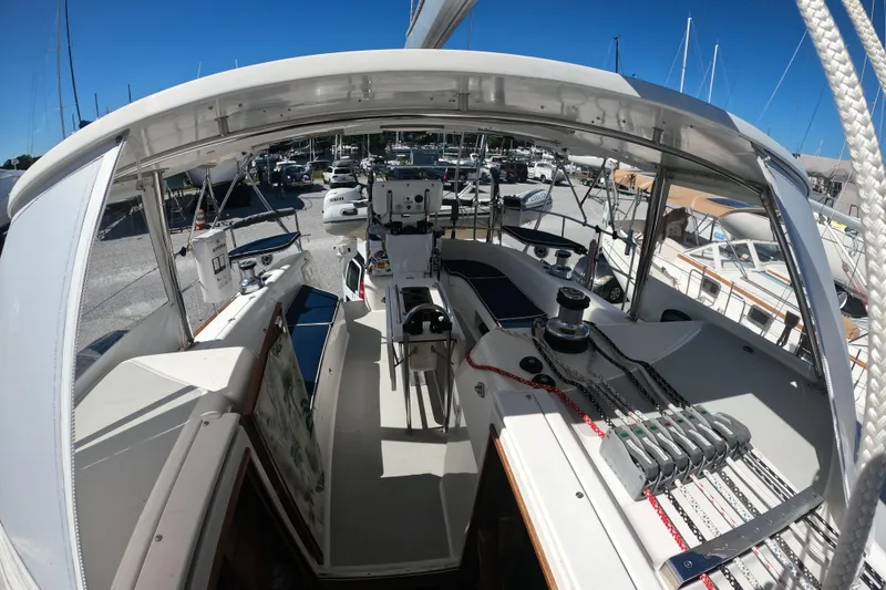 Slide: The Image of 2005 Catalina Morgan 440 sailboat cockpit with ropes and winches, docked in a marina. - 8