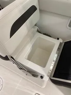 Slide: The Image of 2022 Sailfish 245DC boat seat with built-in storage compartment. - 15