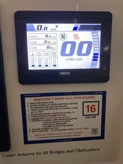 Slide: The Image of Yamaha display on 2022 Sailfish 245DC boat with emergency radio call procedures. - 25