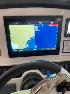 Slide: The Image of Sailfish 245DC 2022 boat dashboard with navigation display. - 26