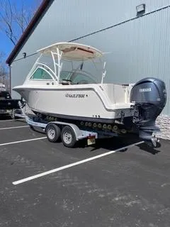 Slide: The Image of 2022 Sailfish 245DC boat on trailer with Yamaha outboard motor in parking lot. - 5