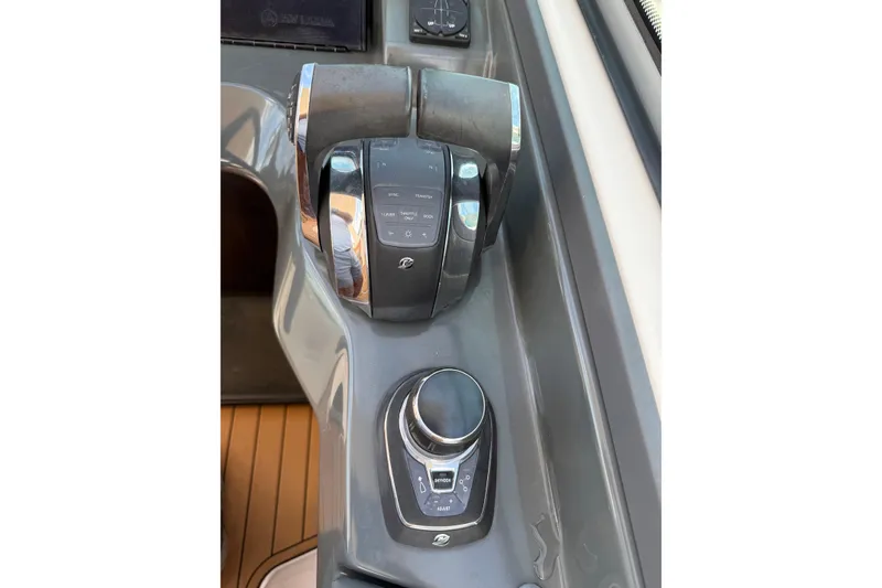 Slide: The Image of Control panel of 2022 Aviara AV32 OB boat with joystick and throttle controls. - 17