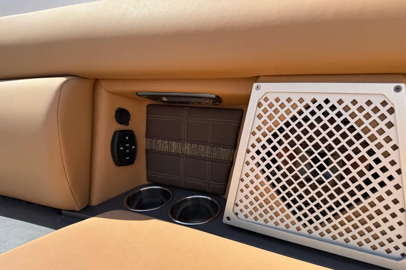 Slide: The Image of Interior of 2022 Aviara AV32 OB boat with speaker, controls, and cup holders. - 24