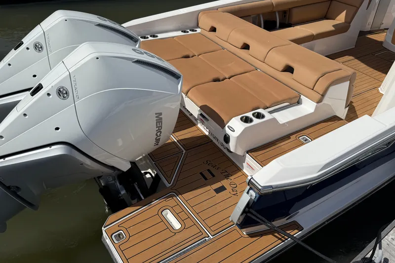 Slide: The Image of 2022 Aviara AV32 OB boat with twin Mercury outboard engines and luxurious seating. - 4