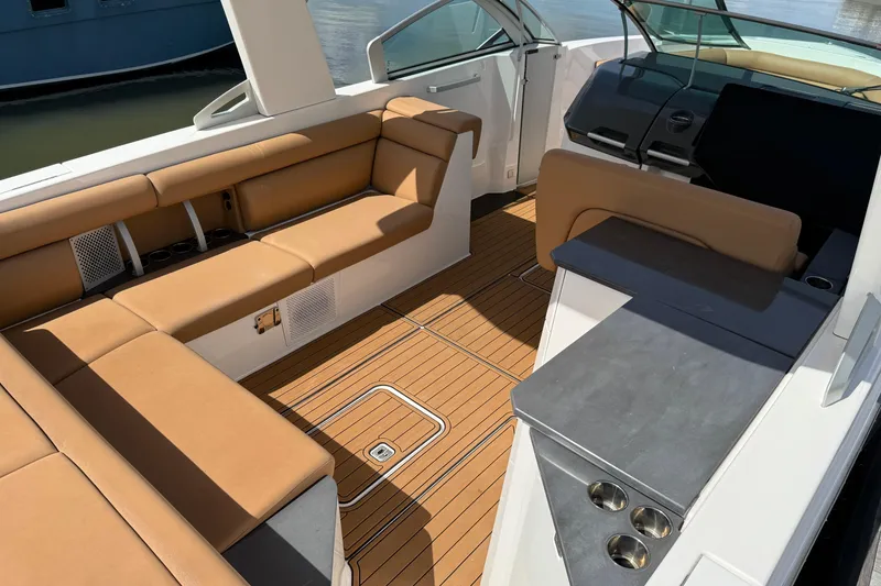 Slide: The Image of 2022 Aviara AV32 OB boat interior with tan seating and sleek design. - 7