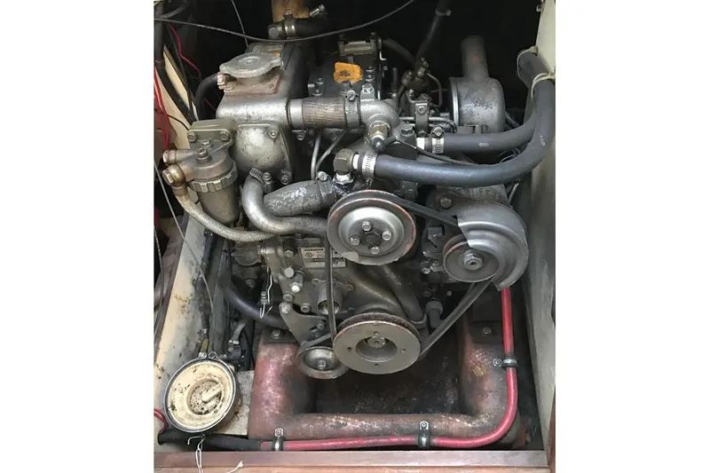 Slide: The Image of 1983 Pearson 303 engine, detailed view of mechanical components and hoses. - 5