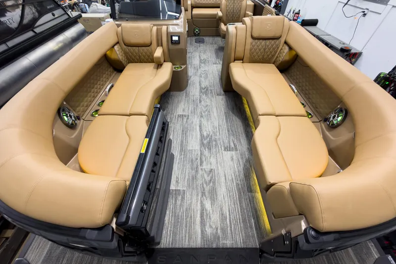 Slide: The Image of Luxurious interior of 2026 Godfrey Sanpan 25' Tritoon with tan seating and modern design. - 13