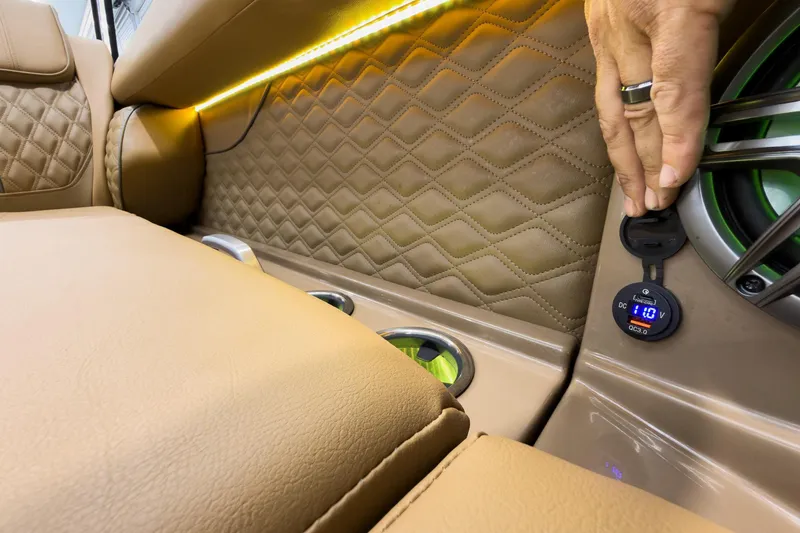 Slide: The Image of Luxurious interior of 2026 Godfrey Sanpan 25' Tritoon with quilted seats and USB charger. - 15