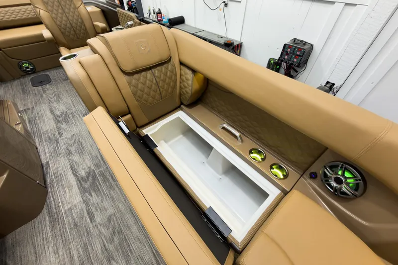 Slide: The Image of Luxurious tan seating with built-in cooler on 2026 Godfrey Sanpan 25' Tritoon. - 17