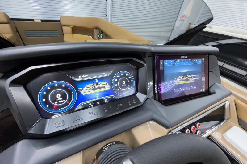 Slide: The Image of Dashboard of 2026 Godfrey Sanpan 25' Tritoon with digital displays and controls. - 26