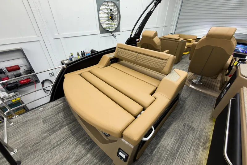 Slide: The Image of Luxurious interior of 2026 Godfrey Sanpan 25' Tritoon with tan leather seating. - 37