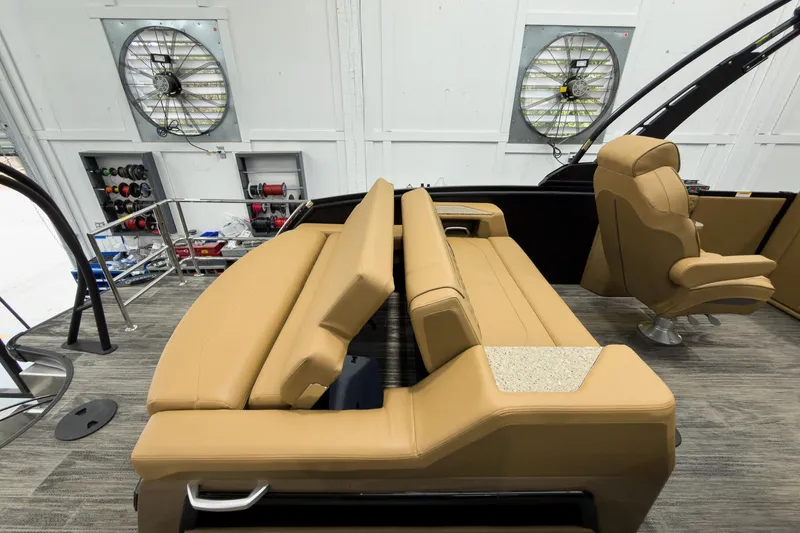 Slide: The Image of Luxurious interior of 2026 Godfrey Sanpan 25' Tritoon with tan seating and co-captain chair. - 39