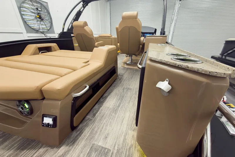 Slide: The Image of Luxurious interior of 2026 Godfrey Sanpan 25' Tritoon with tan seating and modern amenities. - 51