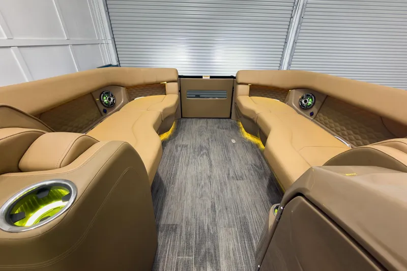 Slide: The Image of Luxurious interior of 2026 Godfrey Sanpan 25' Tritoon with tan seating and modern design. - 54